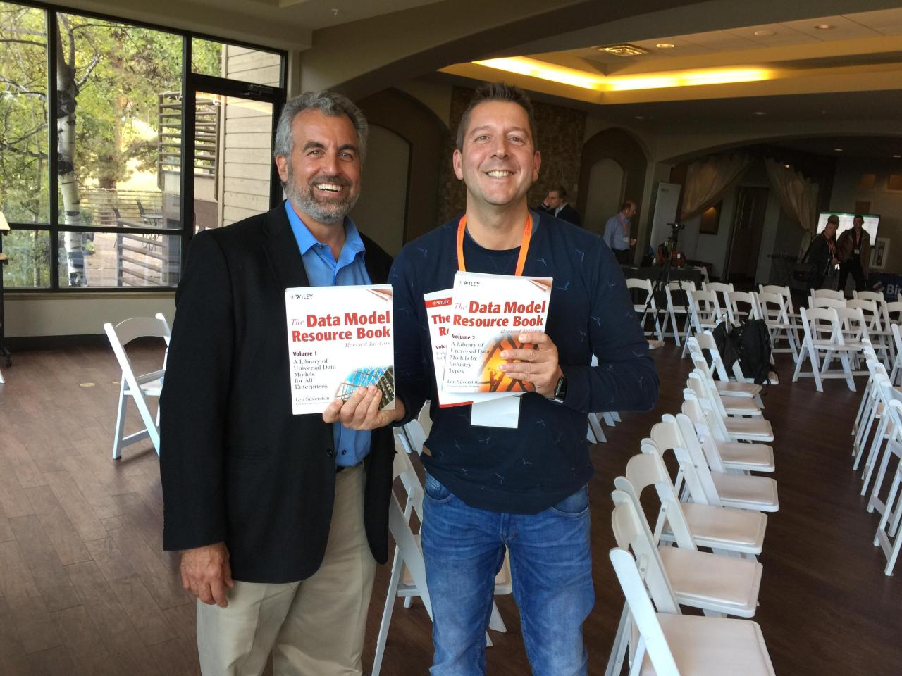 Jaco van der Laan with Len Silverston, holding The Data Model Resource Book volumes